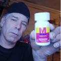 Tony posing with a bottle of Midol